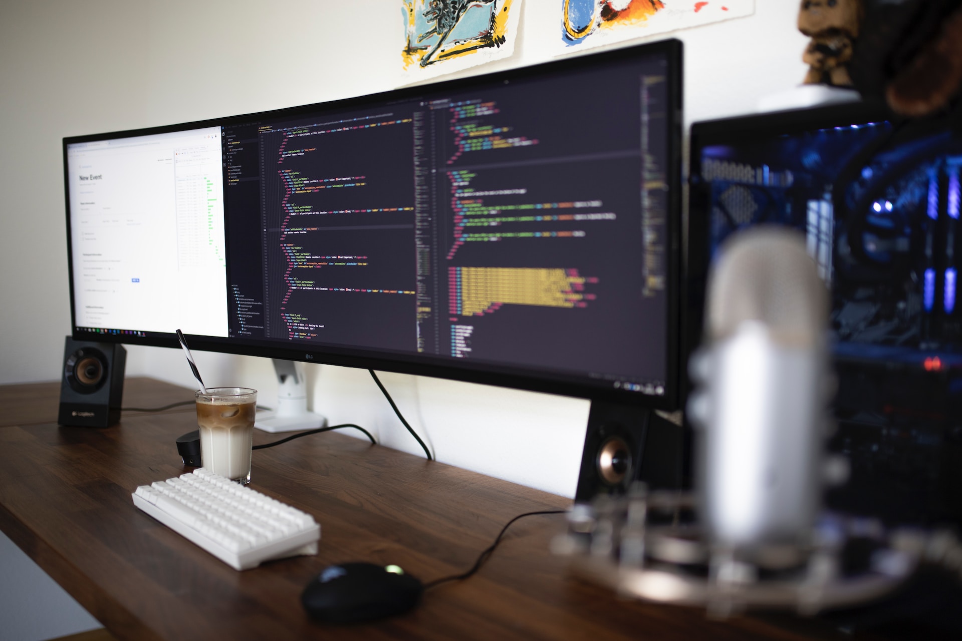 first hackathon experience - desk layout with curved monitor, keyboard and coffee